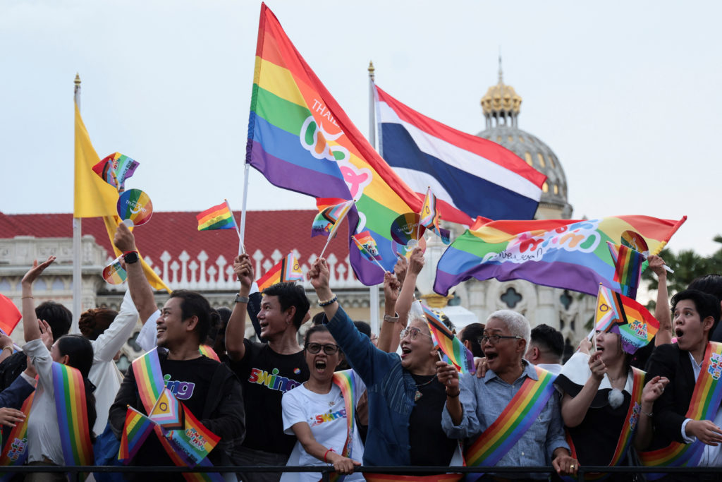 Members of the LGBTQ+ community celebrate after the passing of the marriage equality bill in its second and third readings by the Senate, which will effectively make Thailand Asia's third territory to legalise same-sex unions, at the government house, in Bangkok, Thailand, June 18, 2024. REUTERS/Patipat Janthong