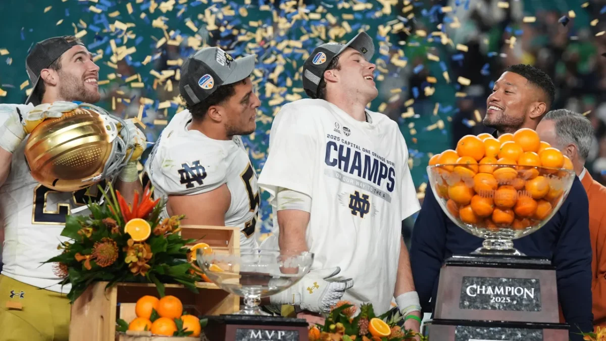 The Notre Dame Fighting Irish, led by head coach Marcus Freeman (right) surprised everybody in the CFP’s new 12-team format. However, their magical season came to an end on Monday night. 