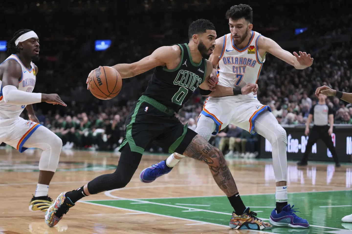 Boston Celtic Jayson Tatum battles against OKC’s Chet Holmgren (right) in a potential Finals preview. The Thunder and Celtics are the two odds-on favorites to win the championship.