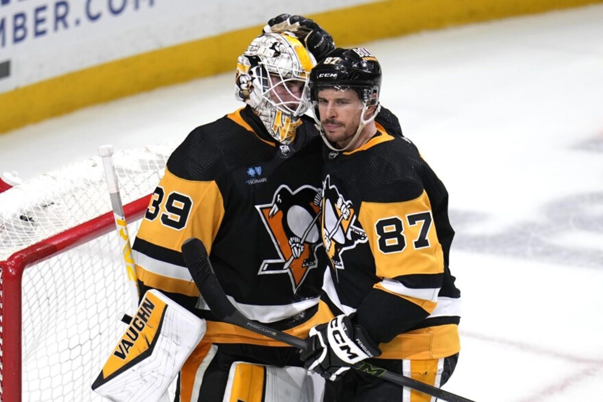 Pittsburgh Penguins’ Captain Sidney Crosby (right) celebrating a win 5-4 against the Tampa Bay Lightning with goalie Alex Nedeljkovic.