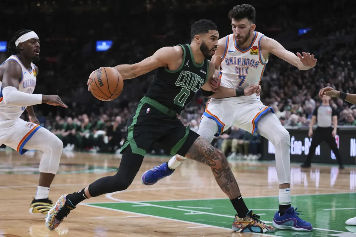 Boston Celtic Jayson Tatum battles against OKC’s Chet Holmgren (right) in a potential Finals preview. The Thunder and Celtics are the two odds-on favorites to win the championship.